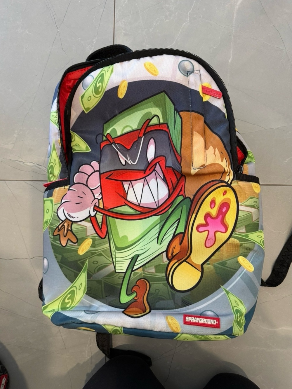Sprayground Cartoon Money Character Backpack - Green, Red, Yellow, Pink, Black